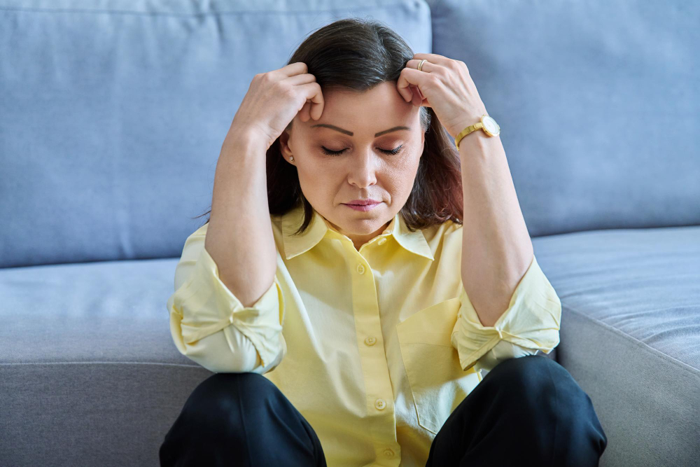 sad-upset-middleaged-woman-sitting-floor-near-sofa