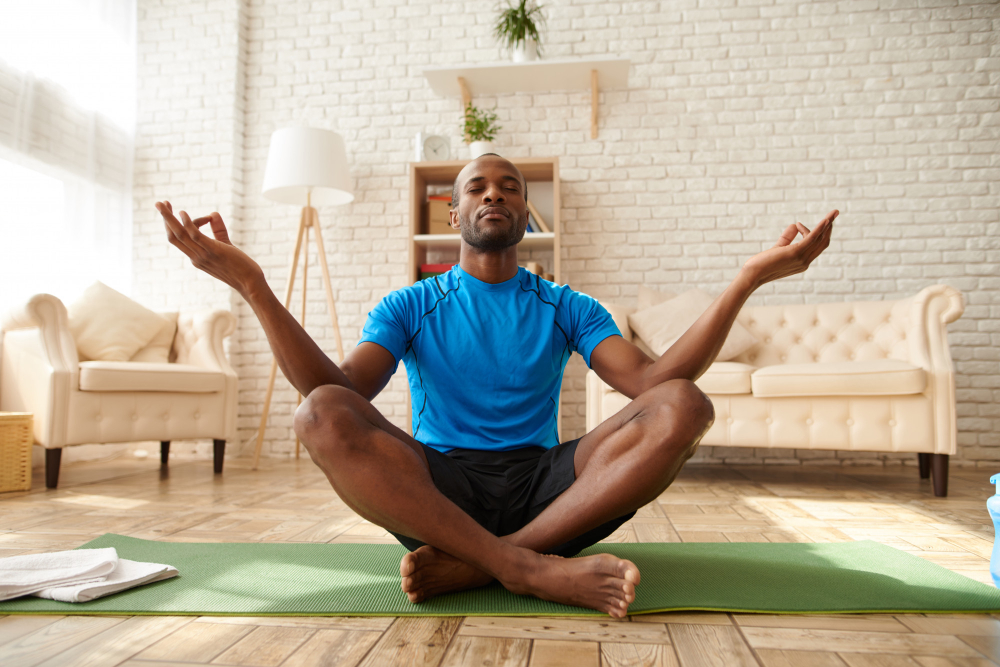 African American man is meditating in lotus