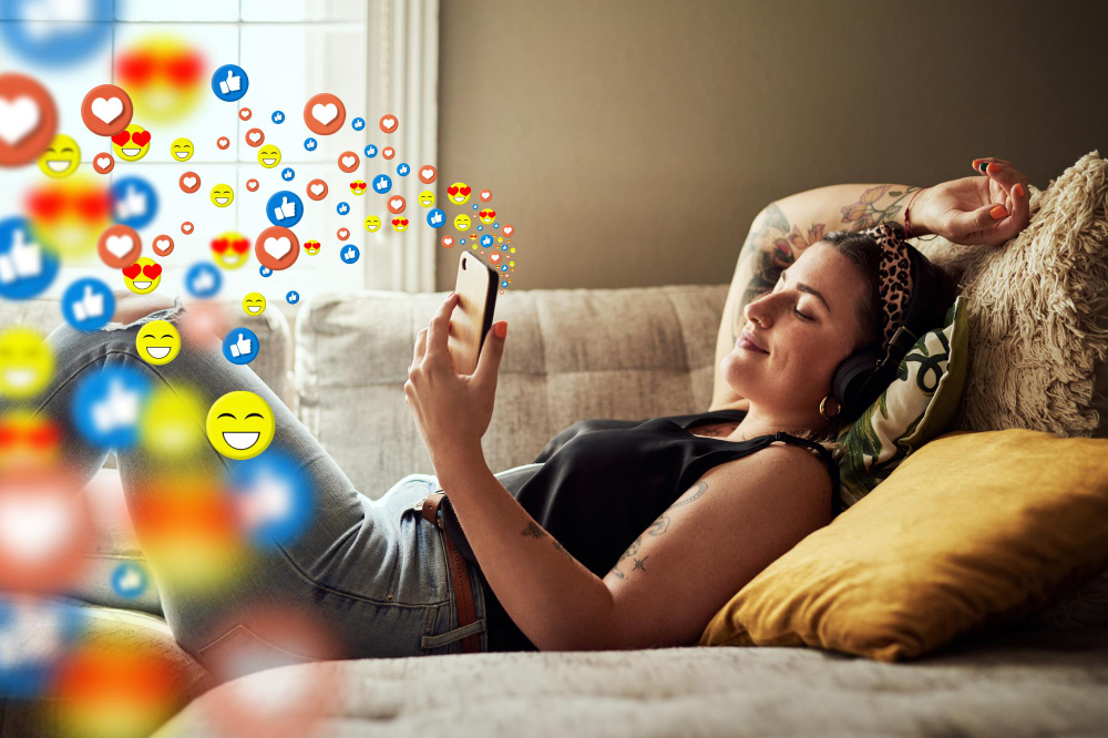 relaxed woman on mobile app network or streaming radio with heart emojis