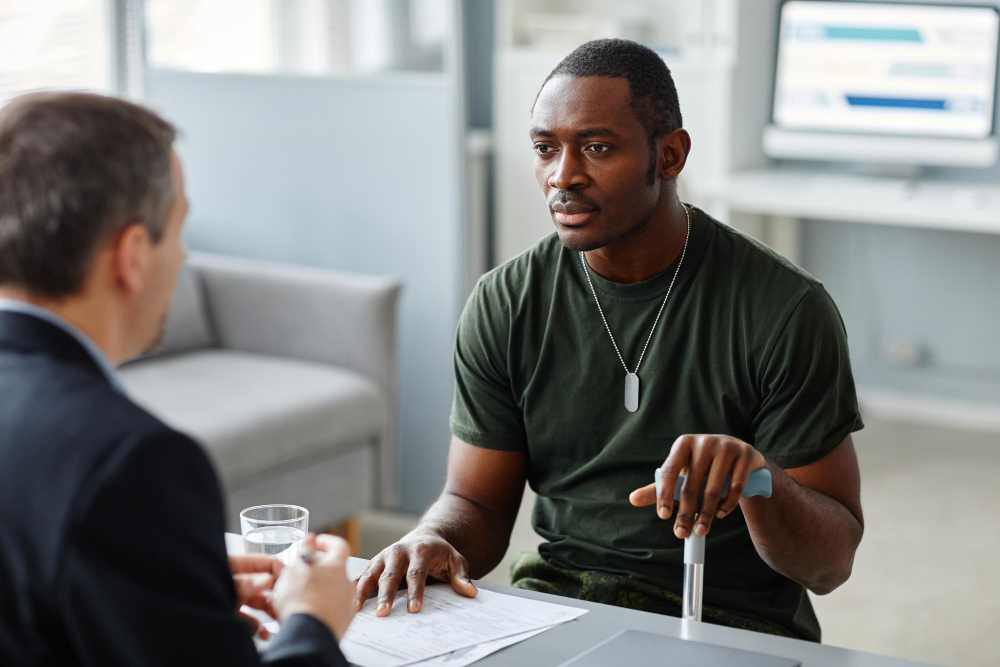 young adult african american with talking about his problems PTSD psychologist