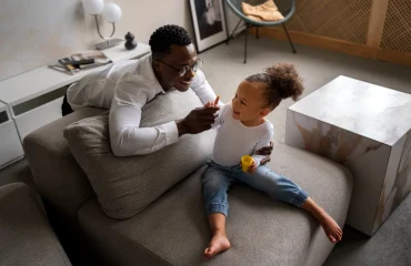 Black baby spending time with her dad