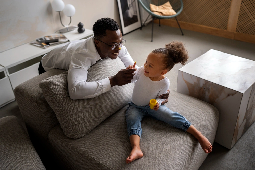 Black baby spending time with her dad