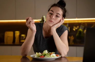 Woman trying to eat healthy at home