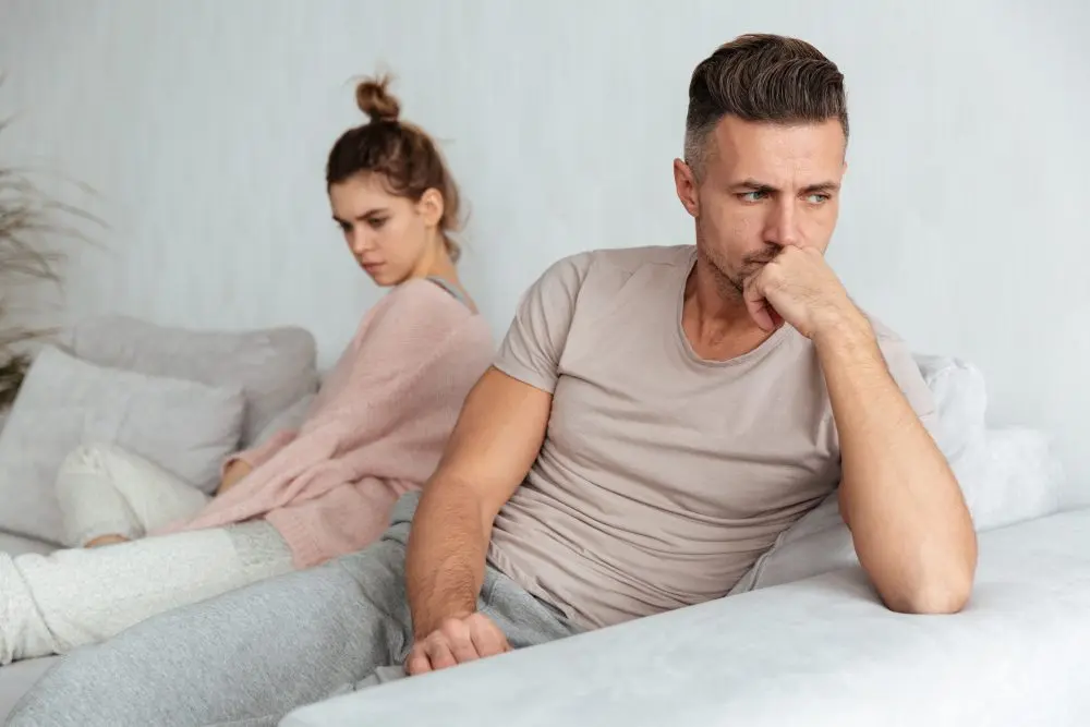 image-quarrelled-lovely-couple-sitting-separately-couch-home