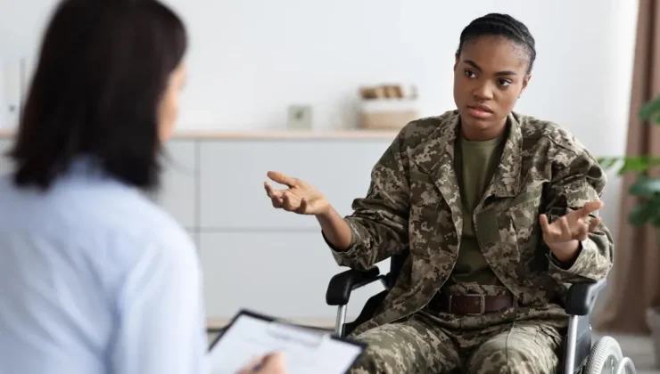 Military uniform with VA Disability Benefits Questionnaire (DBQ)